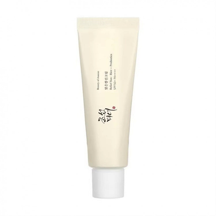 Flatlay of cream tube, sunscreen, and fresh mulberry fruit for brightening.