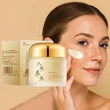 Model applying cream to cheeks, showcasing radiant, hydrated complexion in morning routine.