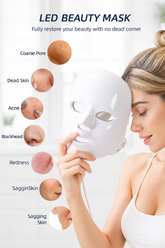 Close‑up of red, amber, and near‑infrared LEDs illuminating skin during treatment.