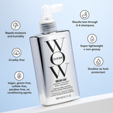 Model applying Dream Coat to smooth curls, achieving weightless hold.