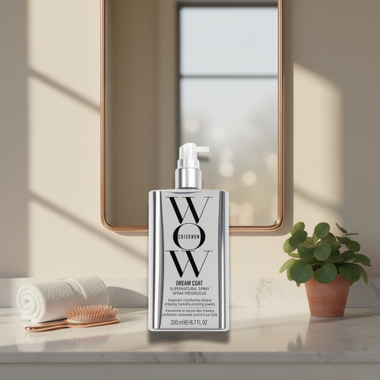 Dream Coat Hair Spray bottle showcasing smooth shine finish on glossy hair.