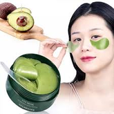 Model applying mask under left eye, demonstrating gentle placement technique.